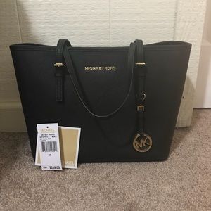 Authentic MK jet set travel tote